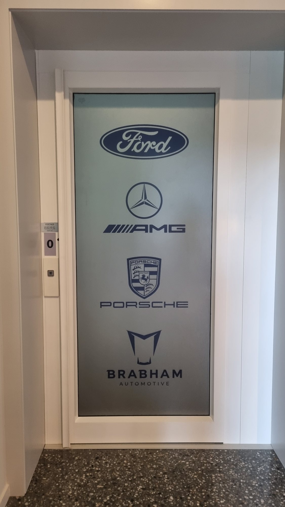 Frosted door graphics with brand logos